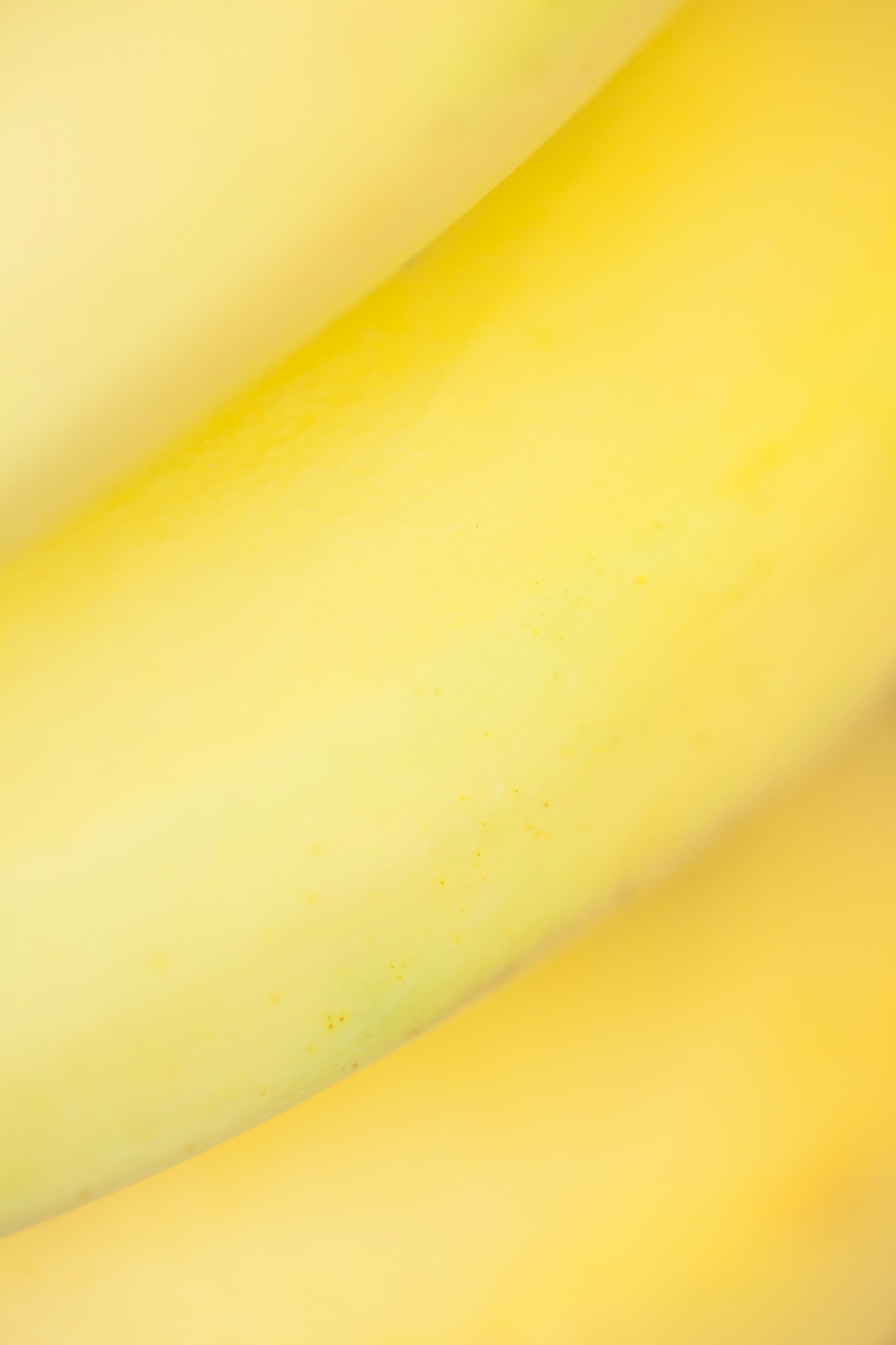 yellow banana fruit on white table